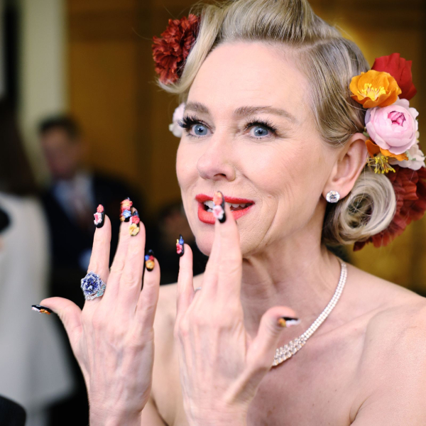 Actress Naomi Watts shows off her 3D flower manicure before the 2026 Met Gala