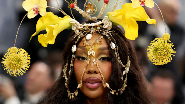 SZA attends the 2026 Met Gala celebrating Costume Art at the Metropolitan Museum of Art in a yellow dress with matching...
