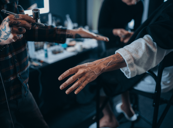 An image of Bad Bunny's arm and hand being airbrushed to look older for the 2026 Met Gala.